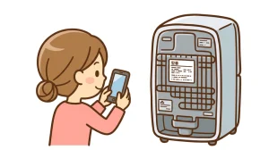 家電の型番を確認している人のイメージ